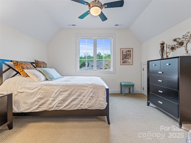 bedroom featuring ceiling fan, light carpet, and vaulted ceiling