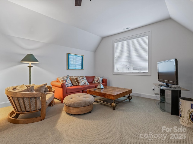 living room featuring carpet and lofted ceiling