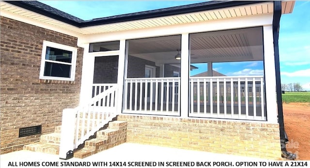 view of side of property with a sunroom