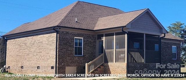 view of property exterior with a sunroom