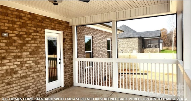 unfurnished sunroom with wood ceiling