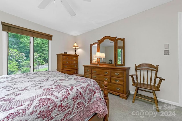 bedroom featuring light carpet and ceiling fan