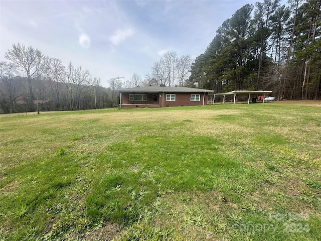 view of yard with a carport