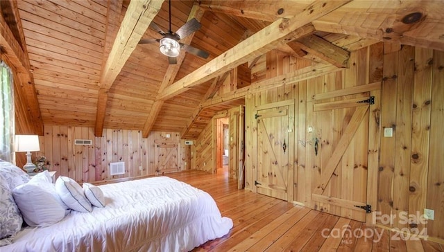 unfurnished bedroom featuring wooden walls, wooden ceiling, vaulted ceiling with beams, and light wood-type flooring