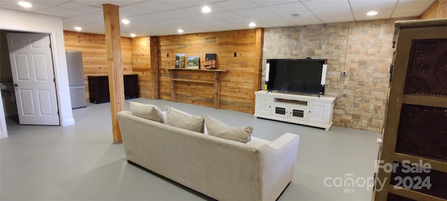 living room featuring a paneled ceiling