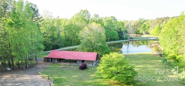 view of nearby features with a lawn and a water view