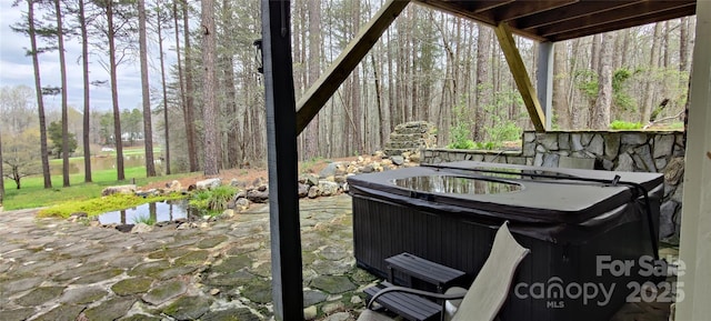 view of patio featuring central AC and a hot tub