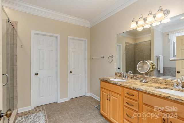 bathroom featuring crown molding, dual bowl vanity, tile floors, and walk in shower