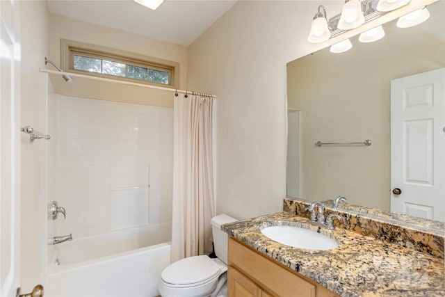 full bathroom featuring toilet, shower / bath combination with curtain, and vanity with extensive cabinet space