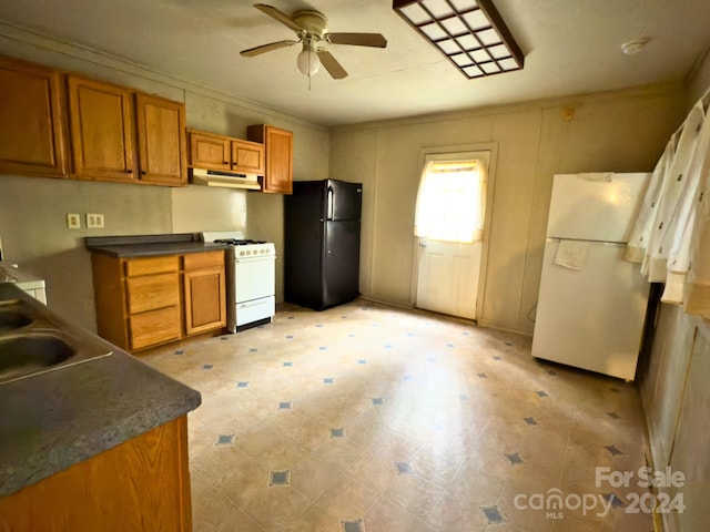 kitchen featuring sink, white appliances, and ceiling fan