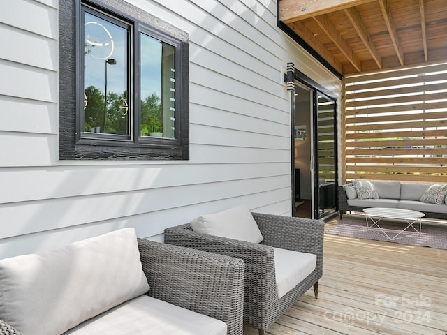 wooden deck featuring an outdoor living space