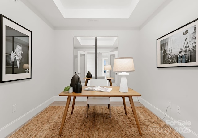 office area featuring a tray ceiling