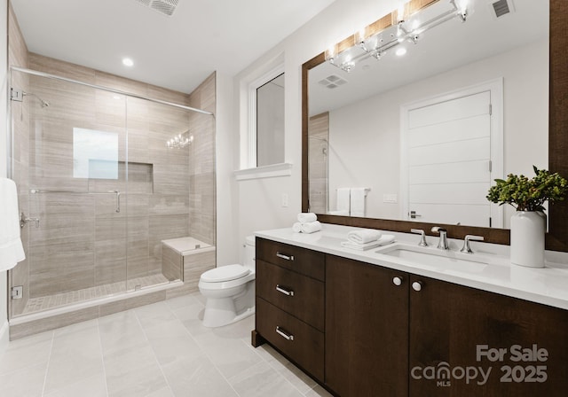 bathroom with toilet, a shower with shower door, tile patterned floors, and vanity