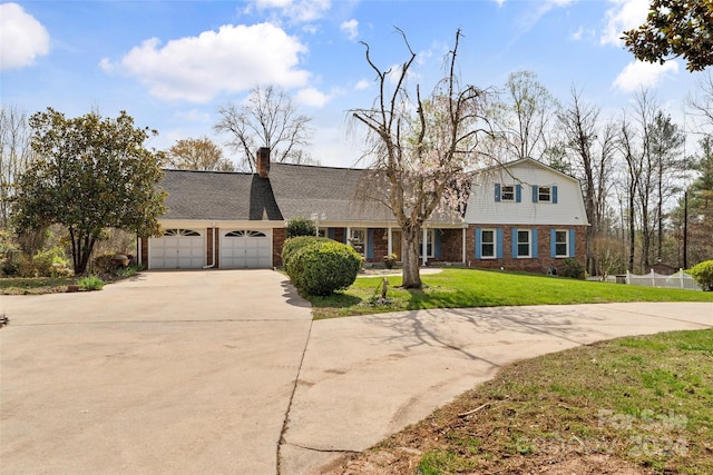 view of front of house featuring a front yard and a garage