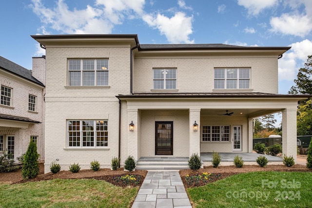 view of front of property featuring a front lawn and a porch