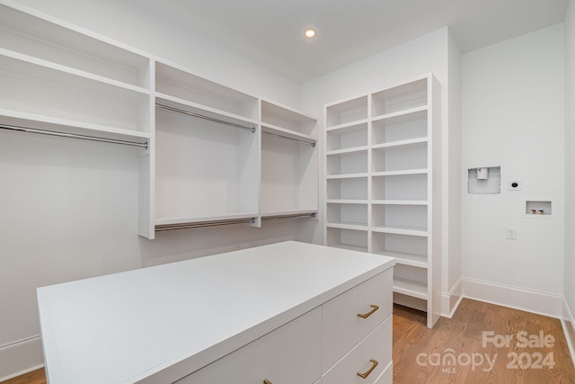 walk in closet featuring light hardwood / wood-style floors