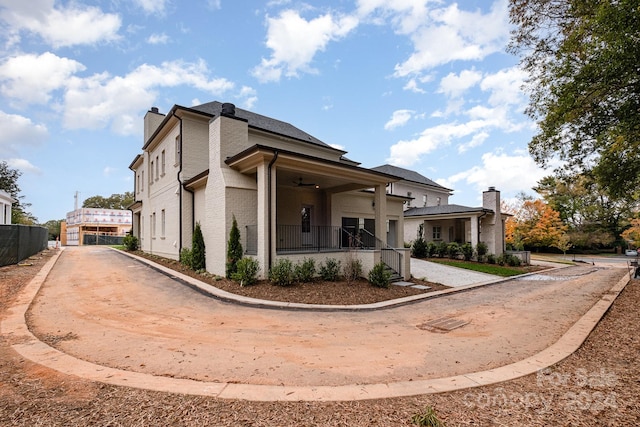 view of side of property featuring ceiling fan