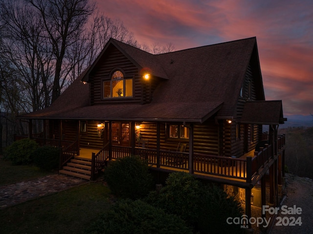 log-style house featuring a deck