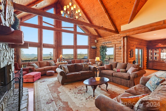 living room featuring high vaulted ceiling, rustic walls, and a chandelier