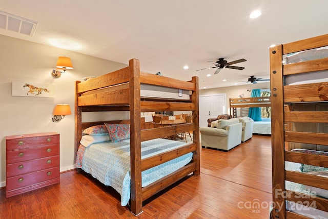 bedroom featuring ceiling fan and dark wood-type flooring