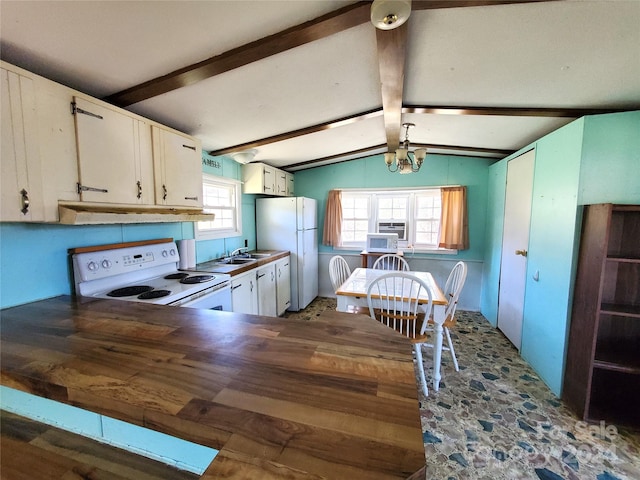 kitchen with white fridge, stove, a chandelier, lofted ceiling with beams, and white cabinetry