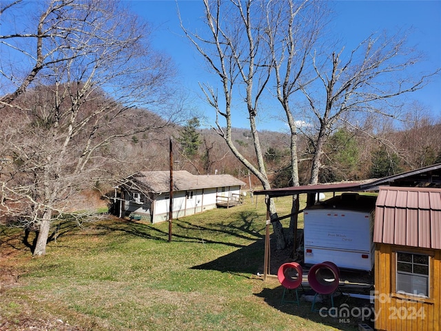 view of yard featuring a carport