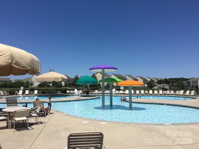 view of swimming pool with a patio area