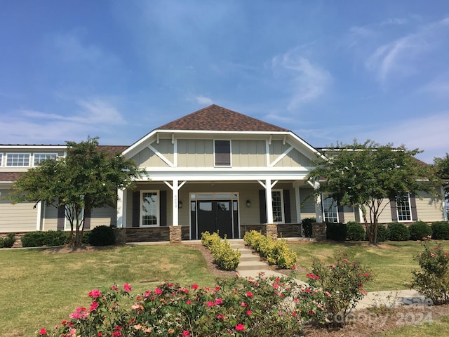 craftsman-style house with a porch and a front yard