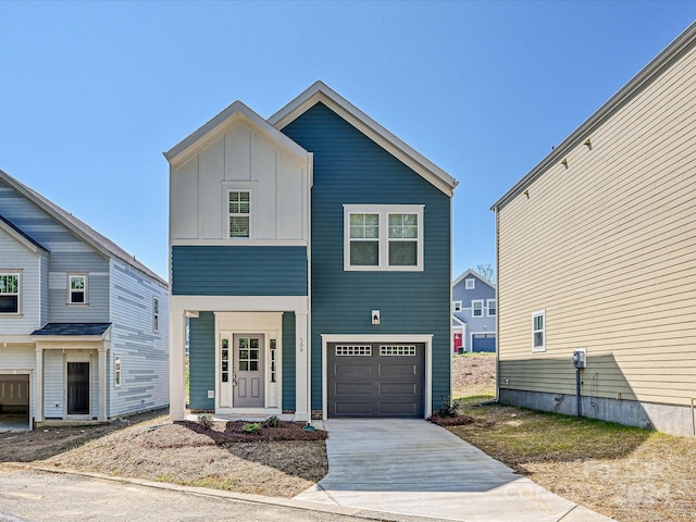 view of front of property with a garage, board and batten siding, and concrete driveway