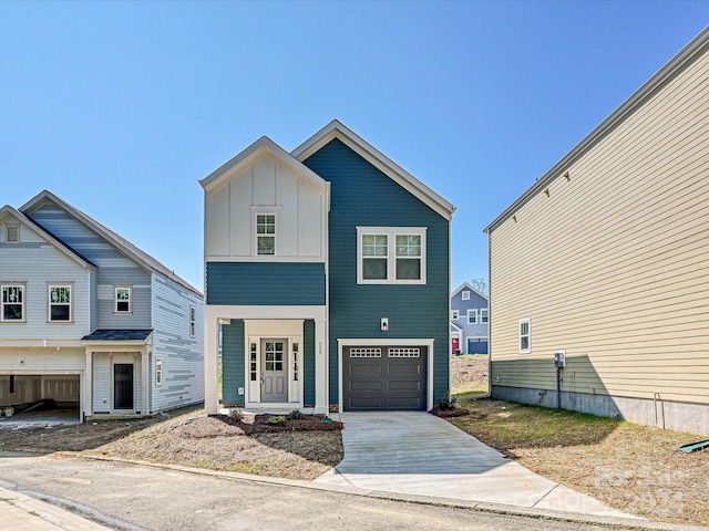 view of front facade featuring concrete driveway, board and batten siding, and an attached garage