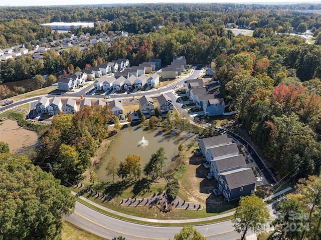 bird's eye view featuring a residential view and a water view