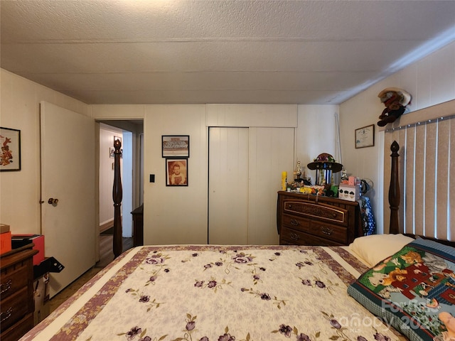 bedroom with a closet and a textured ceiling