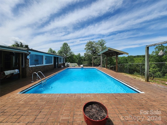 view of pool featuring a patio area