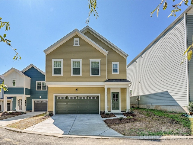 view of front of property with driveway and a garage