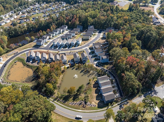 bird's eye view featuring a water view and a residential view