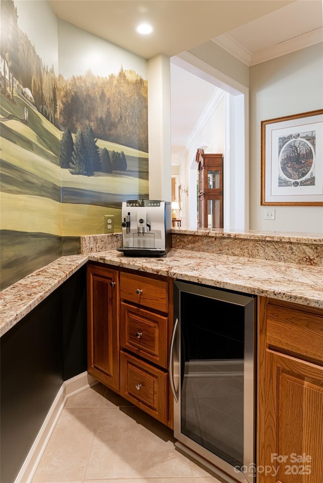 bar featuring light stone countertops, beverage cooler, crown molding, and light tile patterned flooring