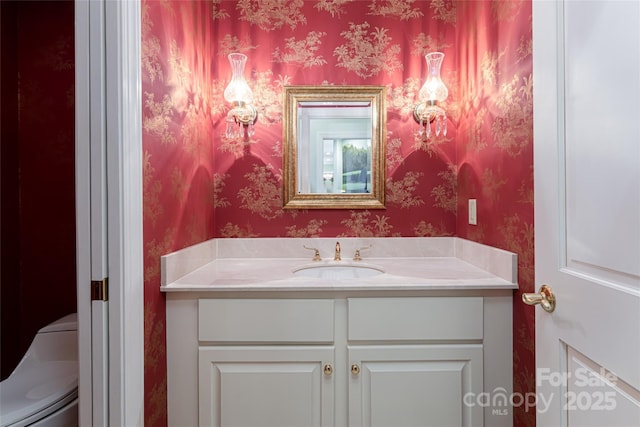 bathroom with toilet and vanity