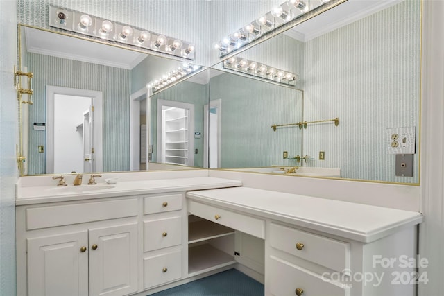 bathroom with vanity and crown molding