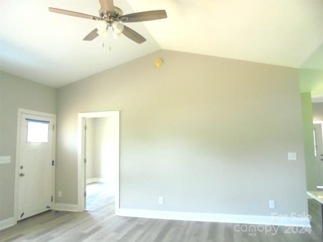 interior space featuring light hardwood / wood-style floors, ceiling fan, and lofted ceiling