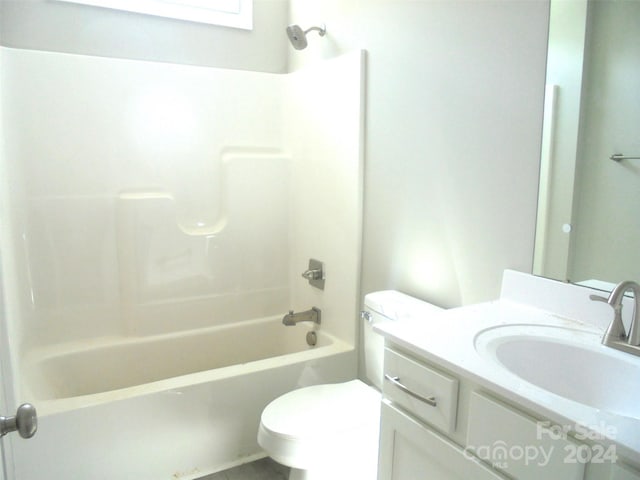 full bathroom with tile patterned floors, vanity, shower / bath combination, and toilet