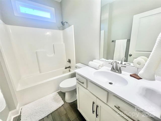 full bathroom with toilet, vanity, shower / bathing tub combination, and wood finished floors