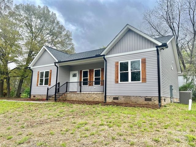 ranch-style home with board and batten siding, a porch, crawl space, and a shingled roof