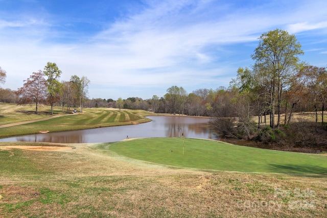 surrounding community featuring a yard and a water view