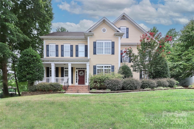 view of front of home featuring a porch and a front lawn