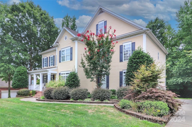 view of front of house featuring a porch and a front yard