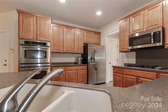 kitchen featuring appliances with stainless steel finishes and sink