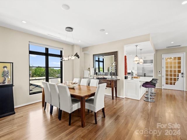 dining room with light wood-type flooring