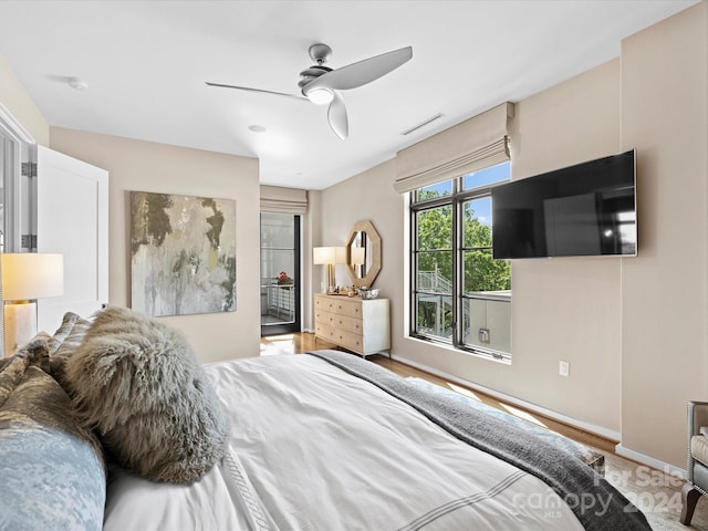 bedroom featuring ceiling fan and light wood-type flooring