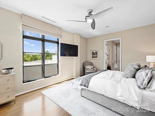 bedroom with ceiling fan and light wood-type flooring