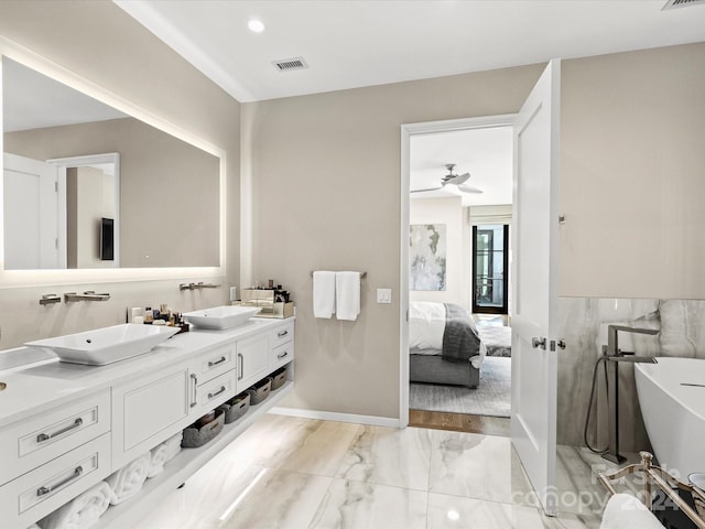 bathroom with ceiling fan, tile floors, and dual vanity